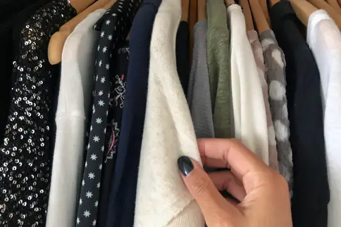 photo of woman deciding what to wear